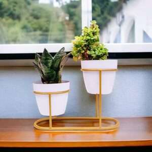 white metal planter with gold stand